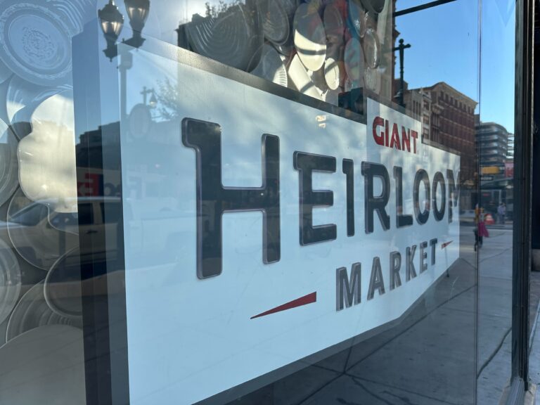 an indoor sign reads GIANT HEIRLOOM MARKET