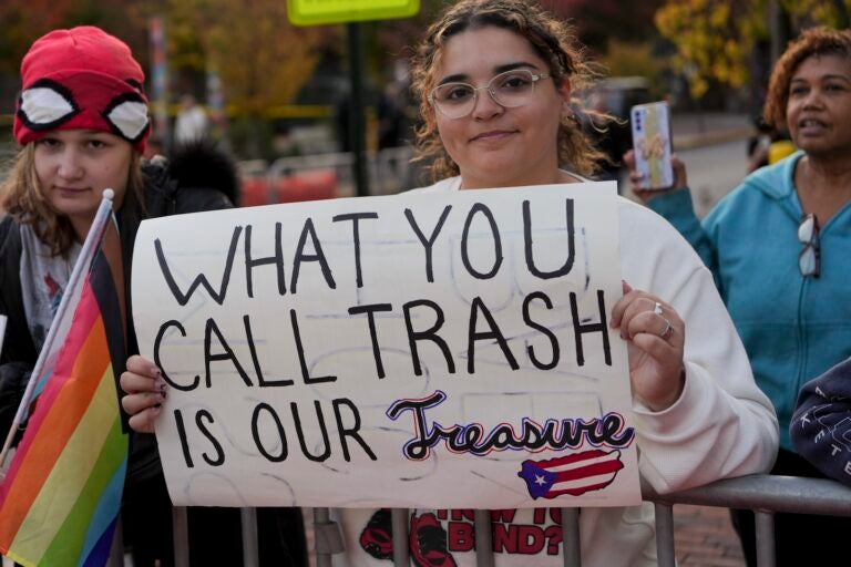 Carmen Hernandez, a Puerto Rican who says she supports Democratic presidential candidate Vice President Kamala Harris, protests against recent racist comments against Puerto Ricans made at a Trump rally in New York's Madison Square Garden, at a Trump rally in Reading, Pa., Monday, Nov. 4, 2024.