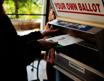 A person drops off a mail-in ballot in October in Doylestown, Pa. Pennsylvania county officials received thousands of last-minute challenges to voters’ absentee ballot applications, most of which were withdrawn shortly after Election Day. (Hannah Beier/Getty Images)