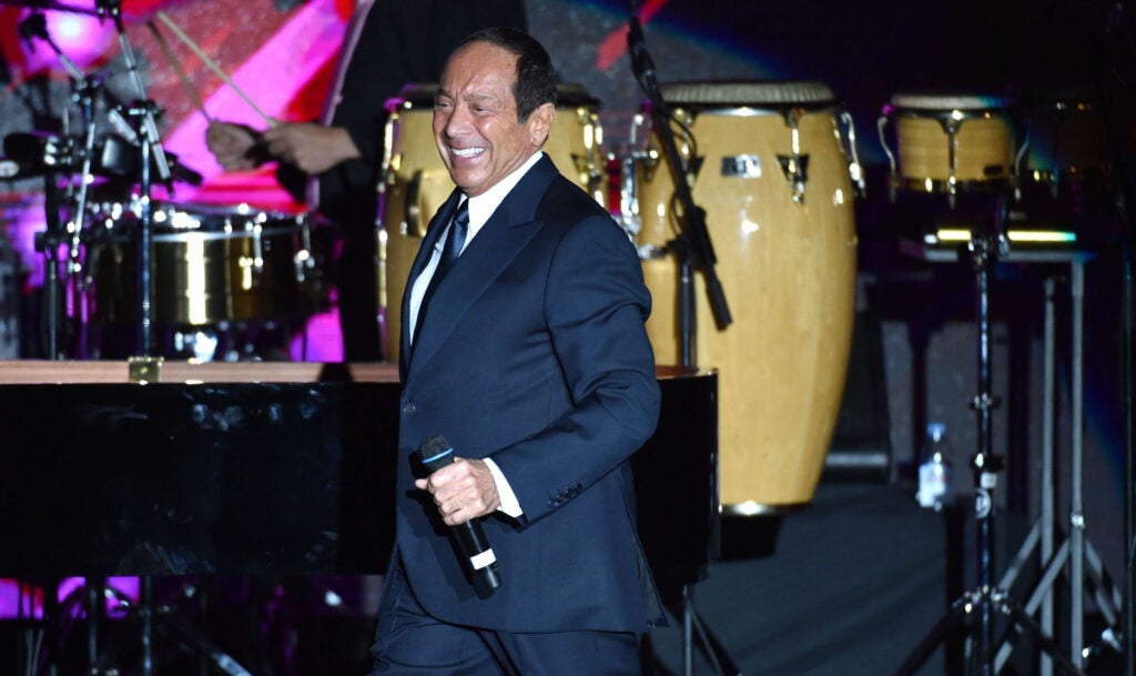 Paul Anka smiles onstage