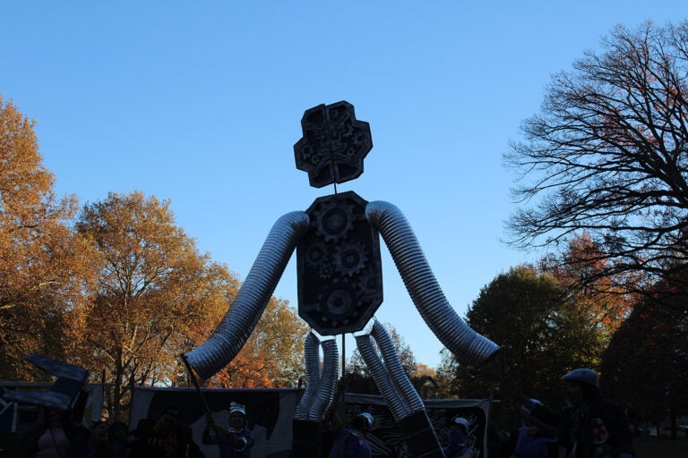 A puppet represented capitalism in the pageant. (Emily Neil/WHYY)