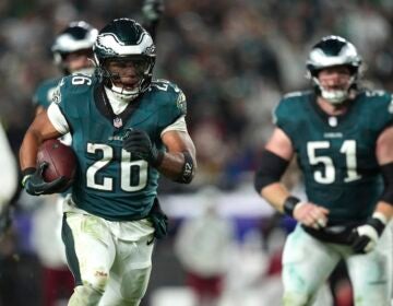 Philadelphia Eagles running back Saquon Barkley (26) runs for a touchdown during the second half of an NFL football game against the Washington Commanders Thursday, Nov. 14, 2024, in Philadelphia.