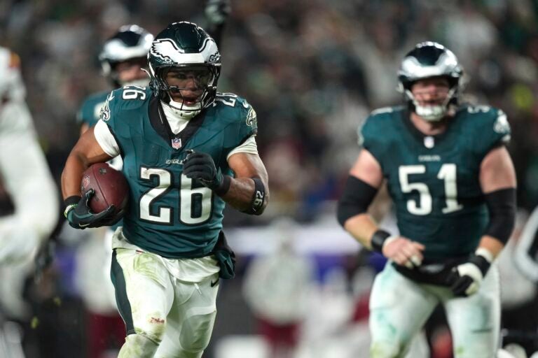 Philadelphia Eagles running back Saquon Barkley (26) runs for a touchdown during the second half of an NFL football game against the Washington Commanders Thursday, Nov. 14, 2024, in Philadelphia.