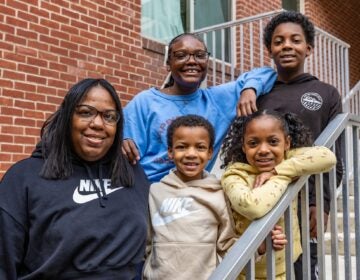 Sophie Wallace and four of her five children smile