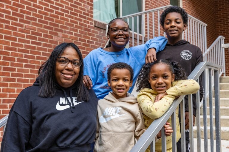 Sophie Wallace and four of her five children smile