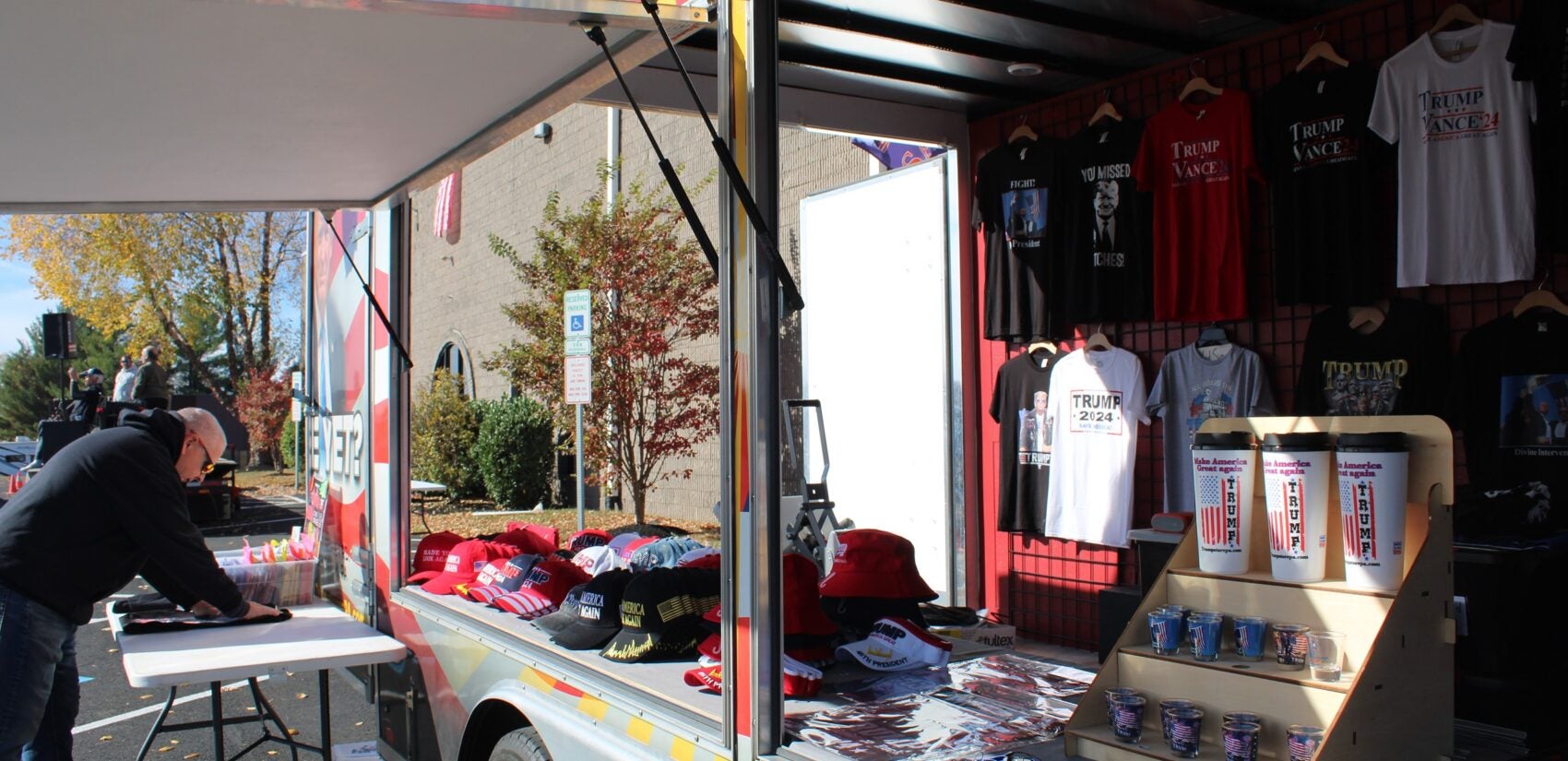 items at the mobile store include shirts, cups and hats