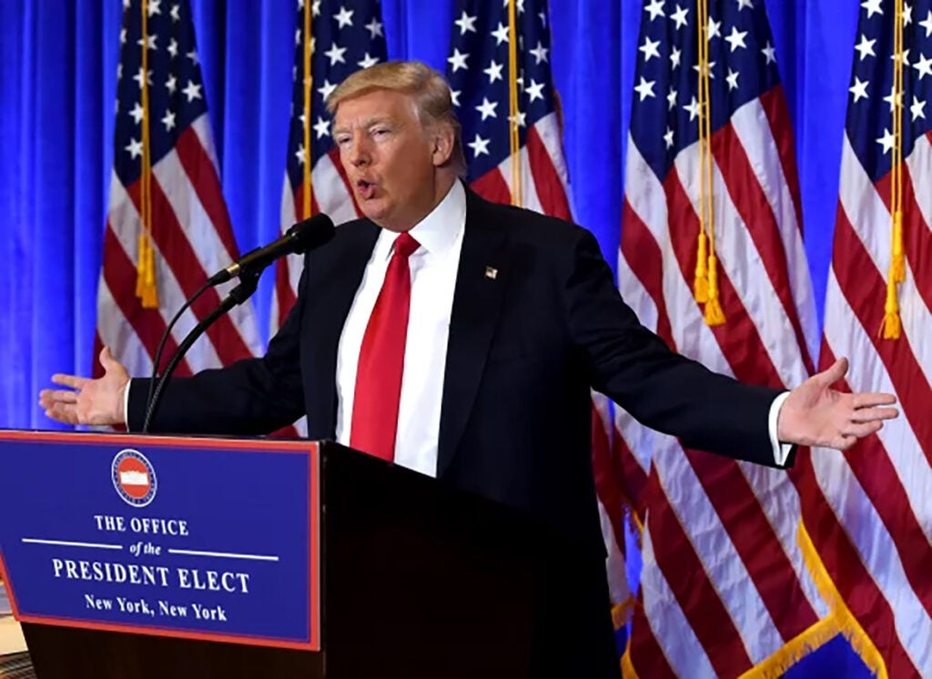 President-elect stands at a podium in 2017