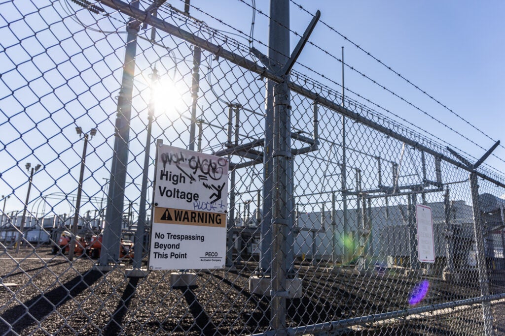 a sign reads HIGH VOLTAGE WARNING on PECO’s substation