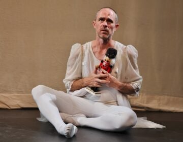 Chris Davis performing ballet while holding a nutcracker