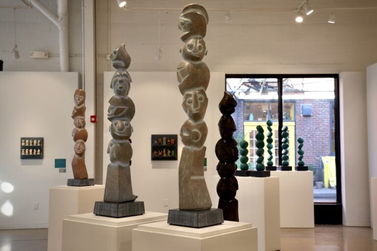 tall, abstract carvings of faces