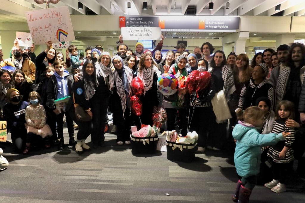 A large group photo at the airport