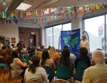 Anuj Gupta, CEO of The Welcoming Center, speaks to a group of people at the center's office in Philadelphia. (Courtesy of The Welcoming Center)