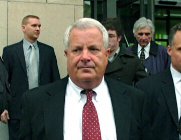 FILE - In this Feb. 12, 2009, file photo, Michael Conahan, center, a former Pennsylvania judge involved in a scheme to send youths to a for-profit jail in exchange for kickbacks, leaves the federal courthouse in Scranton, Pa. (AP Photo/David Kidwell, File)