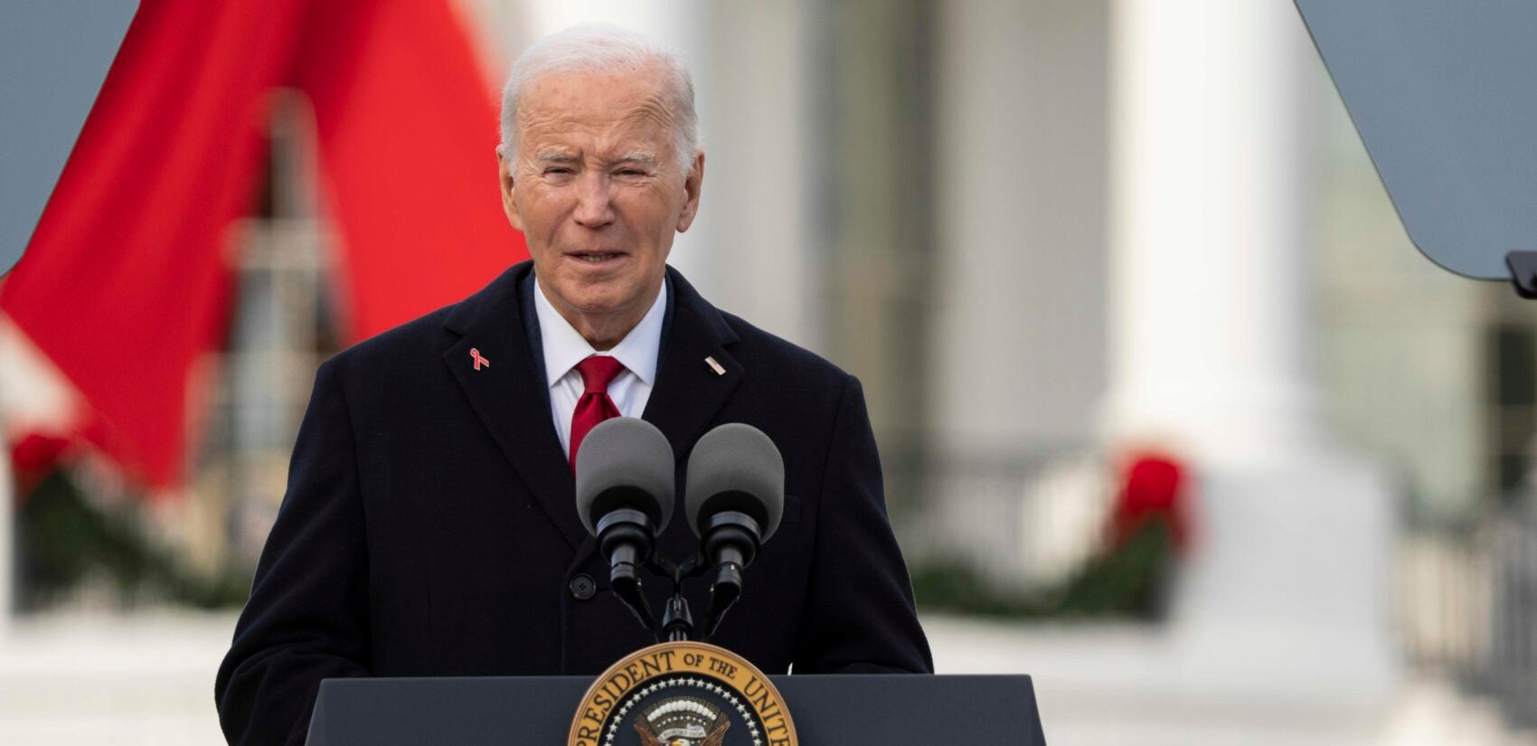 President Joe Biden speaks on the South Lawn of the White House during a ceremony to commemorate World AIDS Day with survivors, their families and advocates, Sunday, Dec. 1, 2024, in Washington. (AP Photo/Manuel Balce Ceneta)