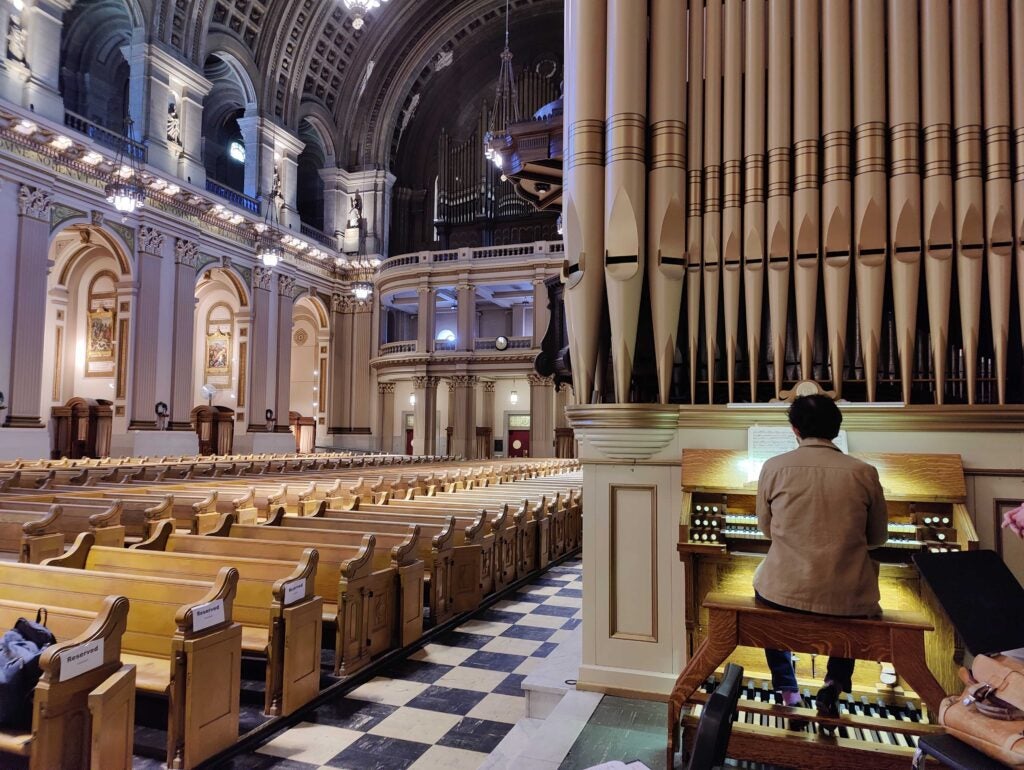 John Walhausen plays the organ in the church