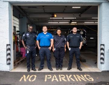 A group photo of 4 EMTS posing at their station