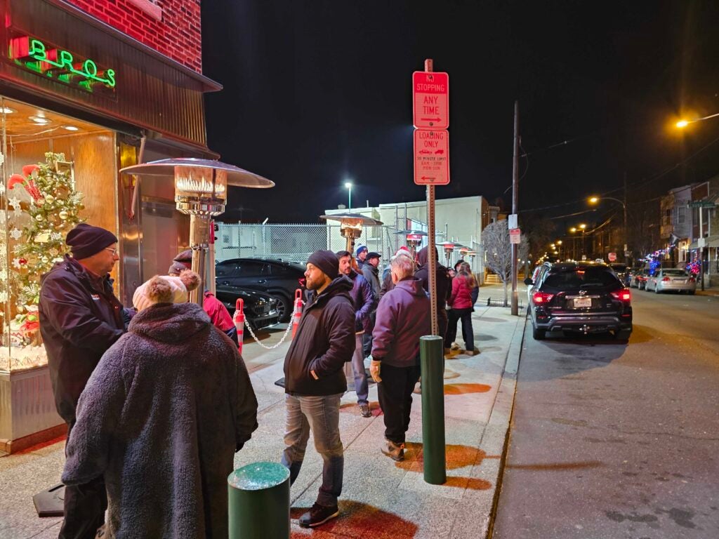 Shoppers in line outside the store