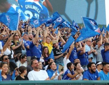 Chelsea fans celebrate after forward Christopher Nkunku's goal against Brighton on Saturday. (Cory Sharber/WHYY)