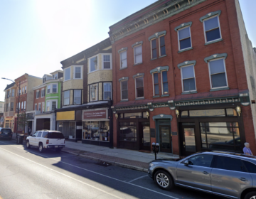 Businesses line a city street