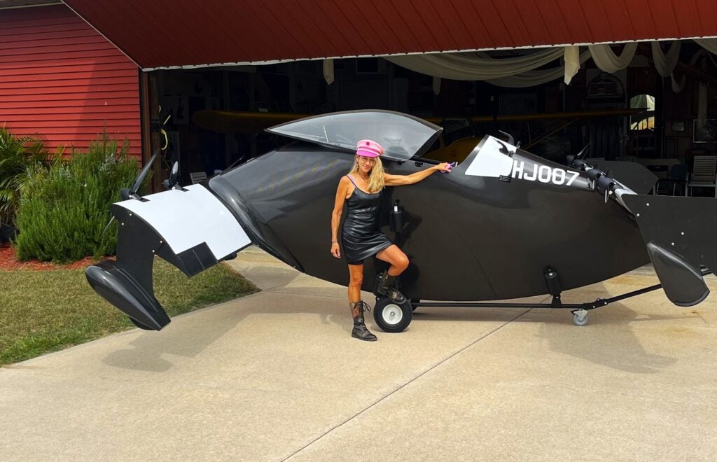 Heather Chirtea stands next to the aircraft