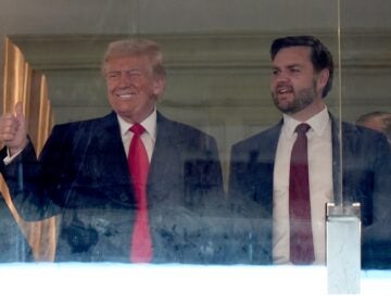 Donald Trump and JD Vance stand and smile