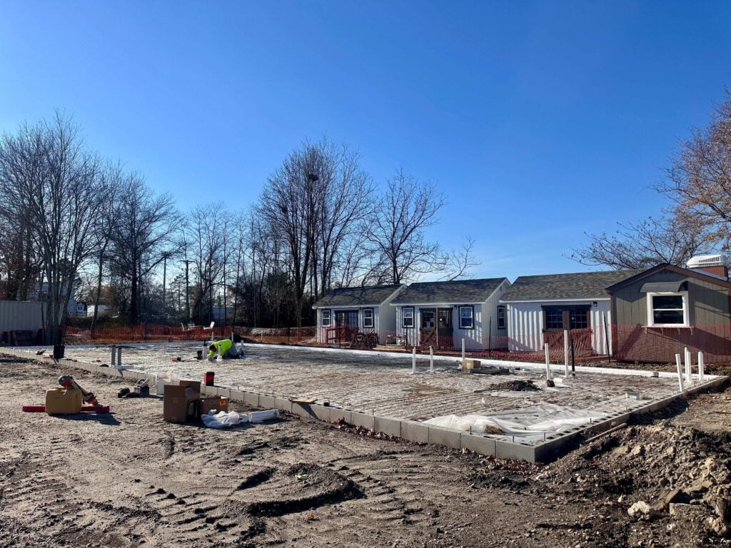 people working on the foundation of the new center