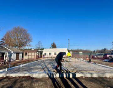 people working on the foundation of the new center