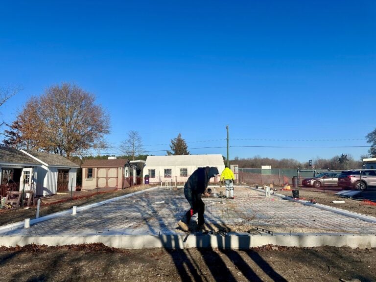 people working on the foundation of the new center