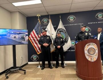 Camden County Police Lt. Gordon Harvey (at podium) and Camden Mayor Vic Carstarphen