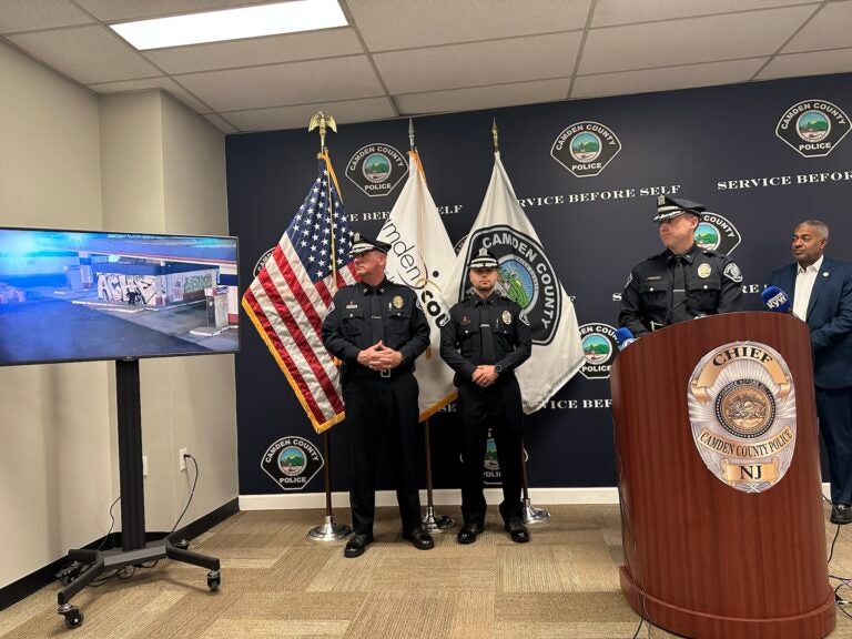 Camden County Police Lt. Gordon Harvey (at podium) and Camden Mayor Vic Carstarphen