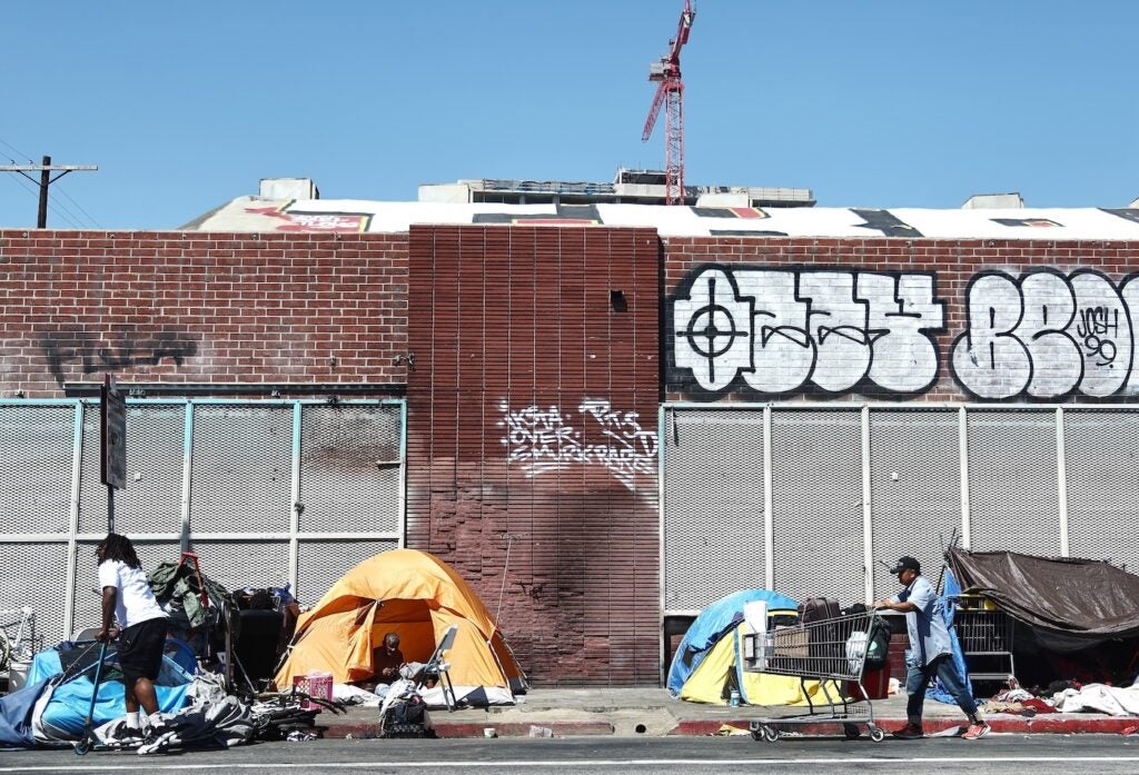 homeless encampment along an abandoned street