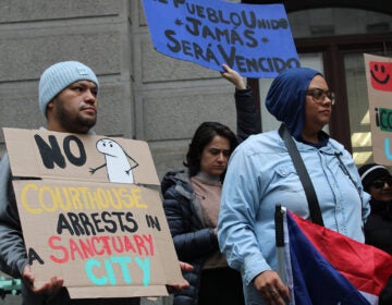 Dozens rally at City Hall on Dec. 10, 2024, calling on Philadelphia elected officials to reaffirm sanctuary city protections for undocumented residents.