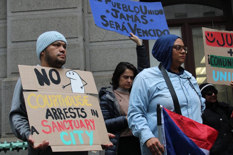 Dozens rally at City Hall on Dec. 10, 2024, calling on Philadelphia elected officials to reaffirm sanctuary city protections for undocumented residents.