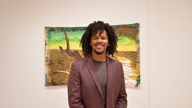 Dr. Matthew Jordan-Miller Kenyatta (Dr. Matt) in the Edgar Heap of Birds Family Gallery, the main exhibitions space for Temple Contemporary. (Ryan Mercado/WHYY)