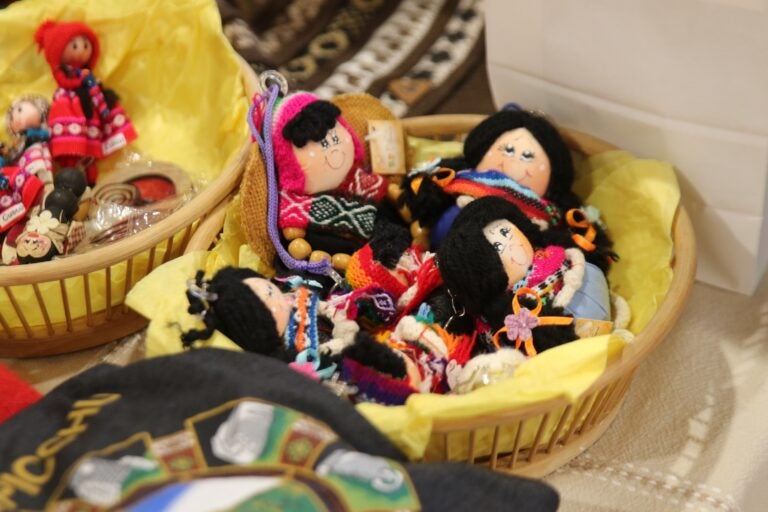 small dolls in a basket