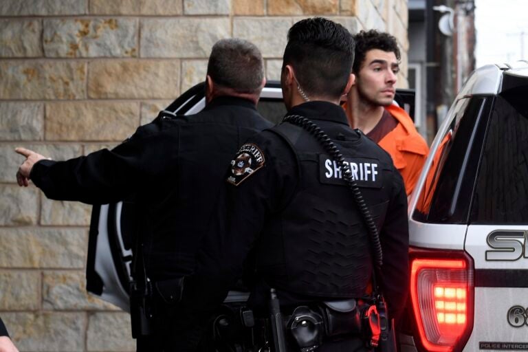 Luigi Nicholas Mangione is escorted into Blair County Courthouse, Tuesday, Dec. 10, 2024, in Hollidaysburg, Pa.