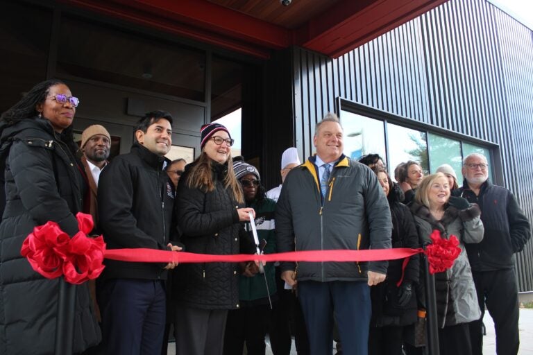 Elected officials and school administrators cut a ribbon