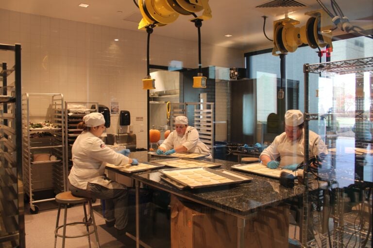 Three student chefs working