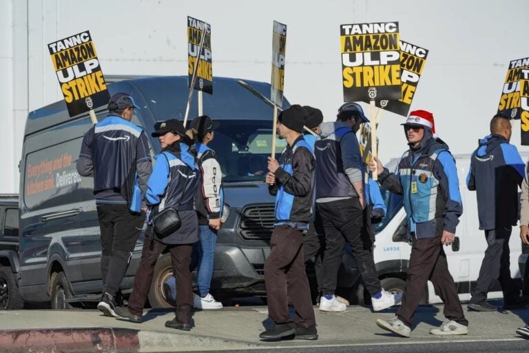 Amazon workers strike outside the gates of an Amazon fulfillment center in City of Industry, Calif., on Thursday. (Damian Dovarganes/AP/AP)