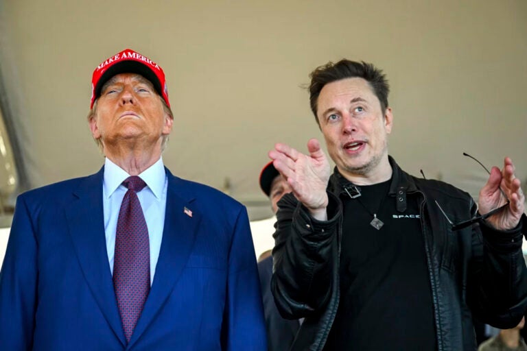 President-elect Donald Trump listens to Elon Musk as he arrives to watch SpaceX's mega rocket Starship lift off for a test flight from Starbase in Boca Chica, Texas, on Nov. 19. (Brandon Bell/Pool via AP)