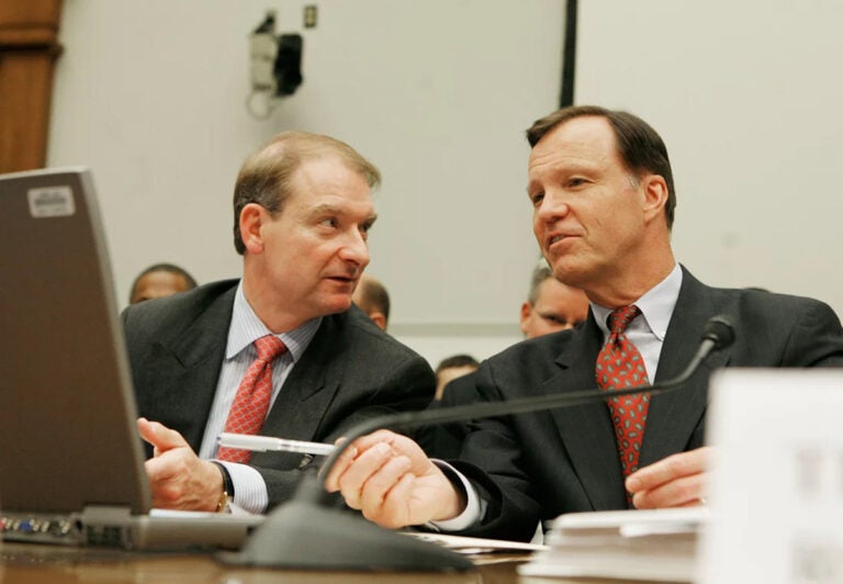 Paul Atkins, left, talks to then SEC Chair Christopher Cox during a House Financial Services Committee hearing on Capitol Hill in Washington, D.C., on June 26, 2007. Atkins was then an SEC commissioner, and he has now been picked by President-elect Trump as the next head of the agency. (Mark Wilson/Getty Images/Getty Images North America)