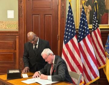 Gov. Phil Murphy signs a pardon