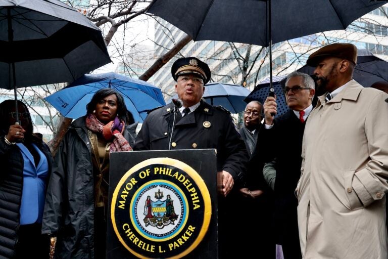 Philadelphia Police Commissioner Kevin Bethel (center) joins Mayor Cherelle Parker in Dilworth Park outside City Hall to address a weekend of violence that ended with four people dead