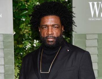 Questlove poses