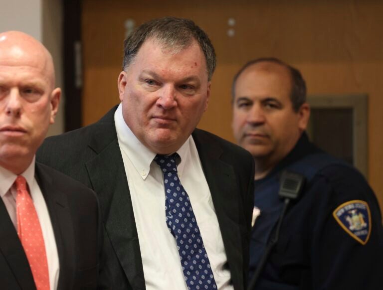 Rex Heuermann, center, charged in the Gilgo Beach serial killings on Long Island, appears for a hearing, Tuesday, July 30, 2024, at Suffolk County Court in Riverhead, N.Y.