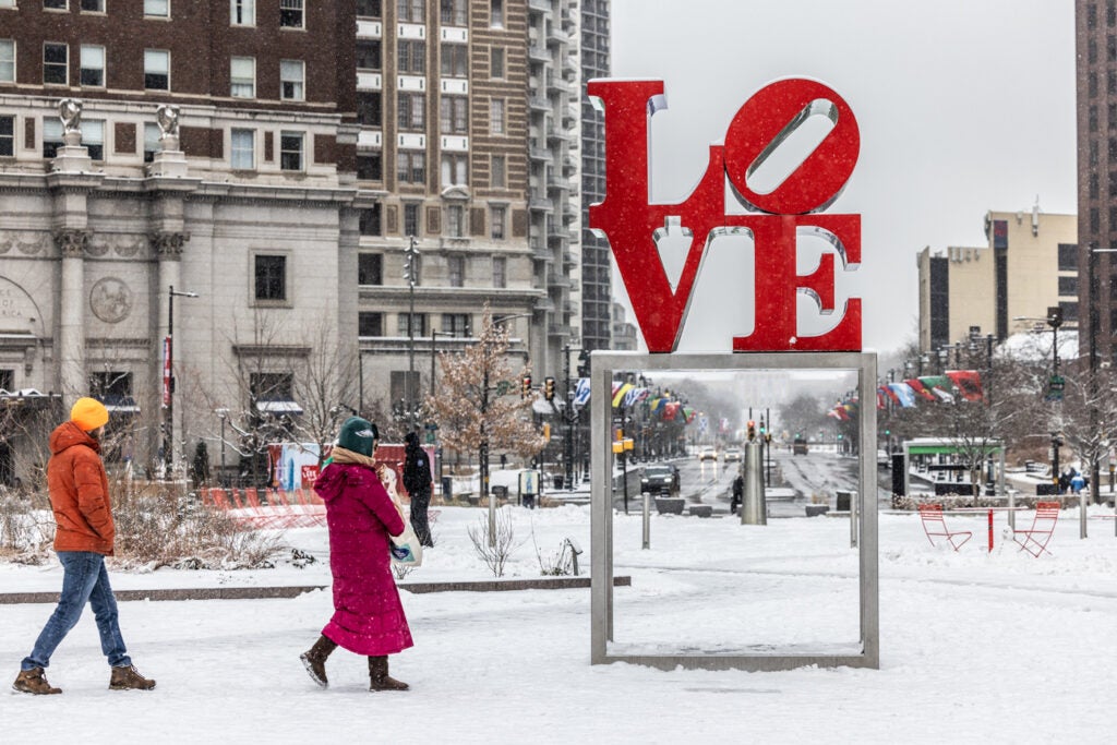 the LOVE Park sign in the snow