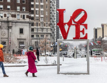 the LOVE Park sign in the snow