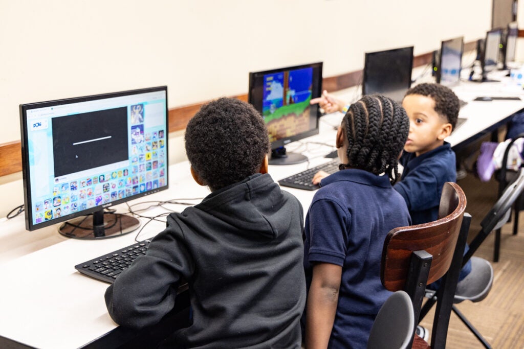 three kids at the computer