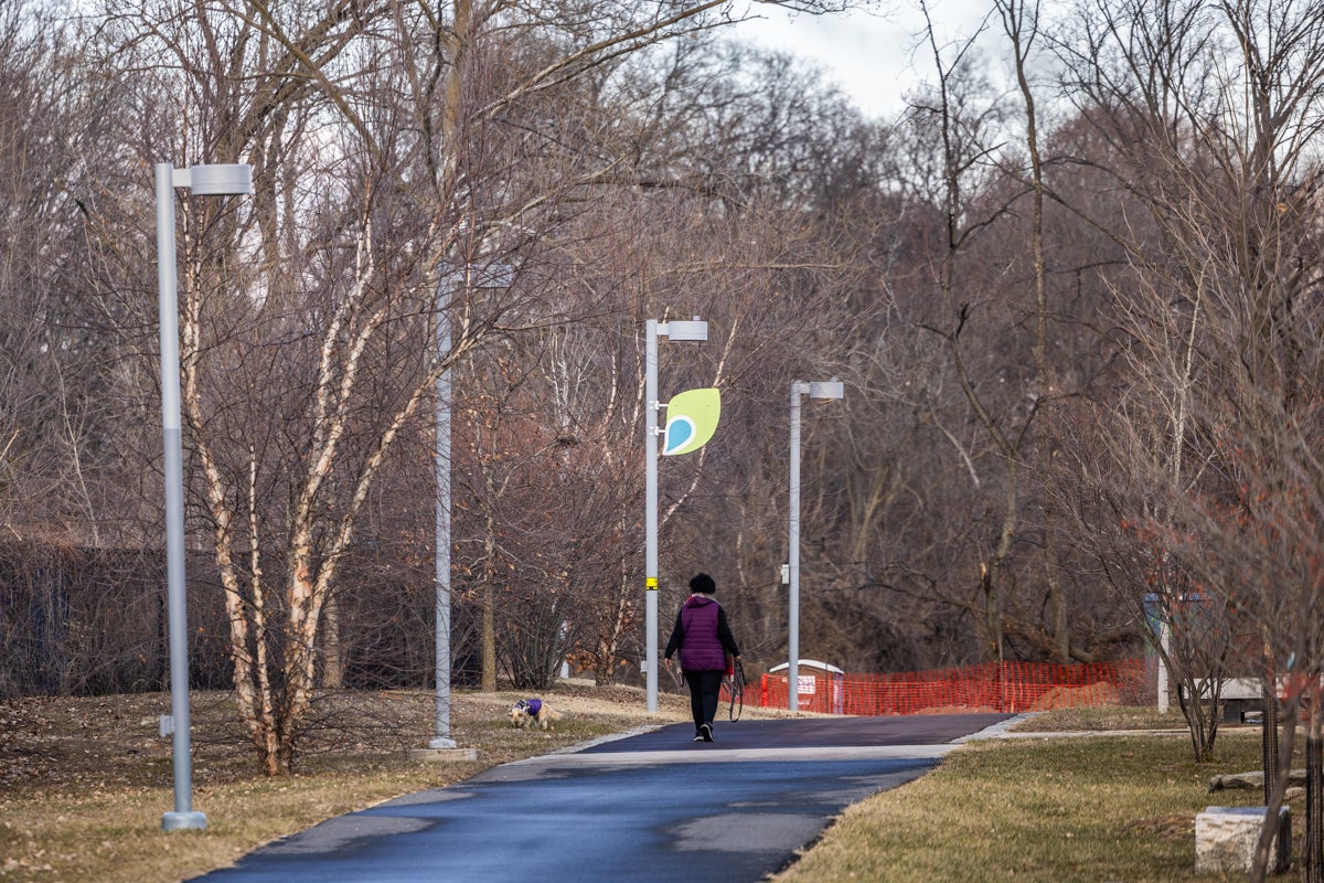 a person walking on the Schuylkill River Trail