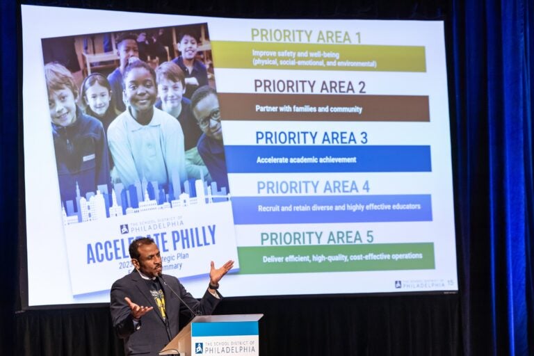 Tony Watlington speaks behind a podium